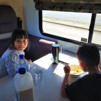 kids-having-breakfast-inside-motor-home-family-rv-caravan-food-travel-eating-motorhome-healthy_t20_lon2RB
