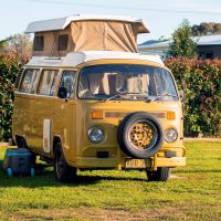 yellow-volkswagen-type-2-kombi-with-roof-top-tent-travel-and-tourism-in-australia_t20_nXrK4P